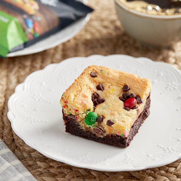 An Individually Wrapped Killer Brownie Kitchen Sink Brownie with candy on top.