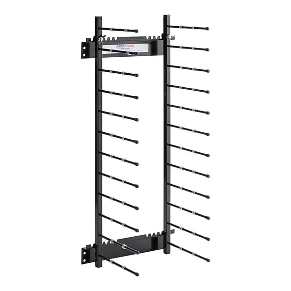 A black metal JackStack wall-mounted plate rack with long rods for 12 plates.