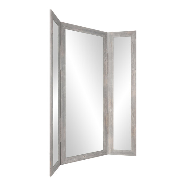 A white rectangular BrandtWorks trifold mirror with a silver wooden frame.