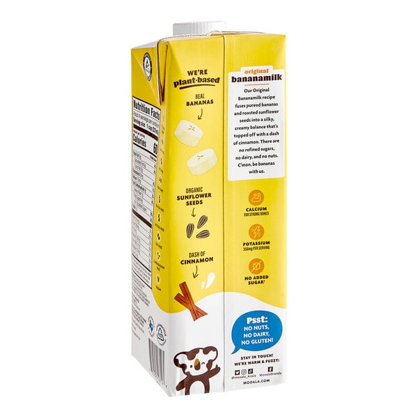 A yellow Mooala Organic Plant-Based Banana Milk carton with a logo and label.