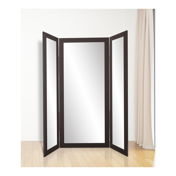 A BrandtWorks matte black trifold dressing mirror.