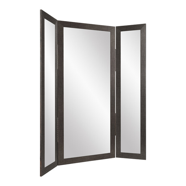 A BrandtWorks black trifold dressing mirror with a black border and three rectangular mirrors.
