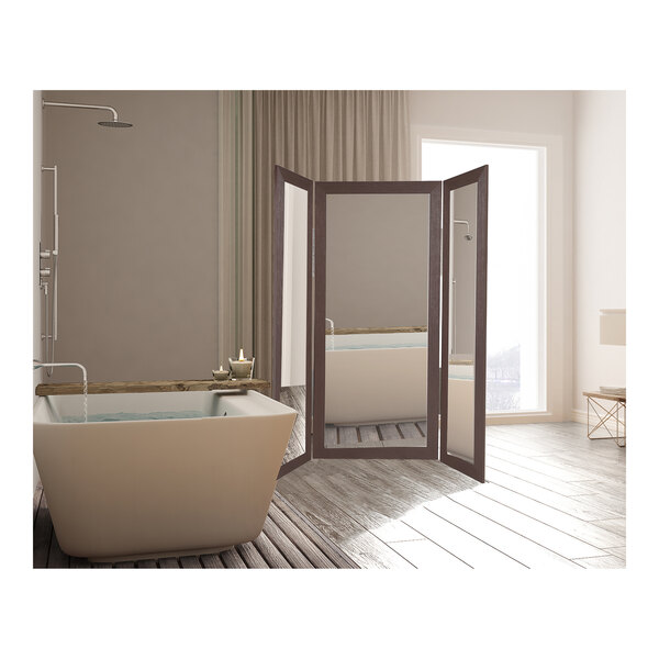 A BrandtWorks trifold dressing mirror in a white bathroom.