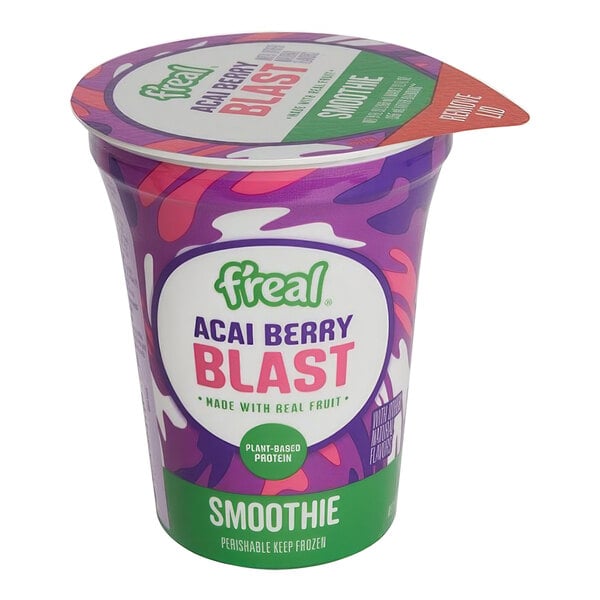 A plastic container of f'real Acai Berry Blast smoothie with a purple and green label.