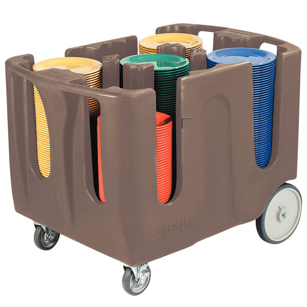 A brown Carlisle plastic container with dividers holding plates.