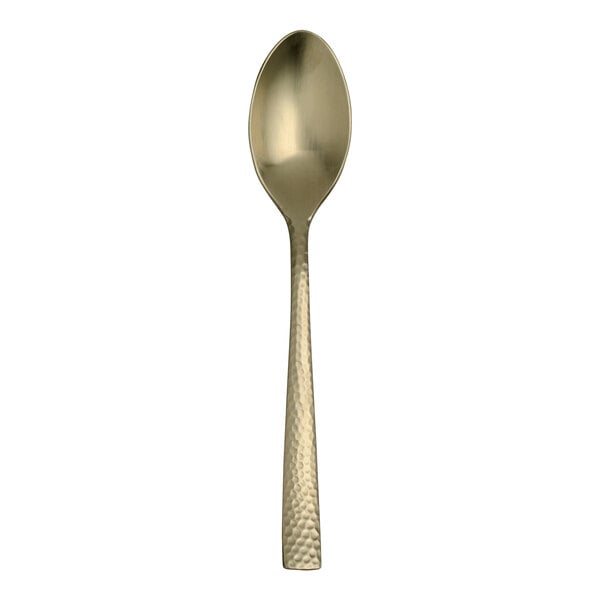 A Varick Malcolm stainless steel dessert spoon with a gold handle on a white background.