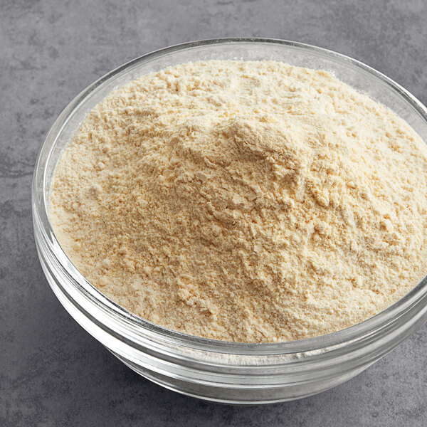 A bowl of McCormick Culinary Onion Powder on a table.