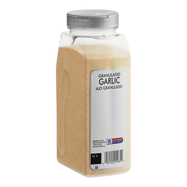A plastic container of McCormick Culinary Granulated Garlic with a white label.