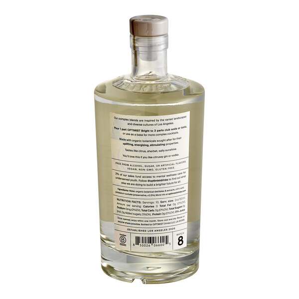 A clear plastic bottle of Optimist Botanicals Bright Non-Alcoholic Spirit with a label.