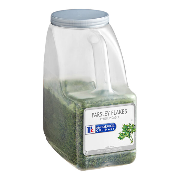 A plastic container of McCormick Culinary Parsley Flakes.