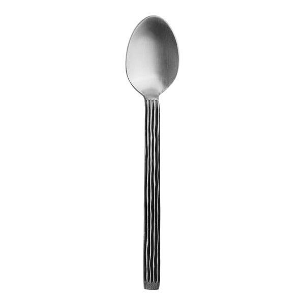 A Varick Briar stainless steel teaspoon with a black handle.