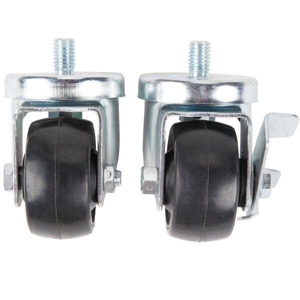 Two Traulsen stem casters with black rubber wheels and nuts on them.