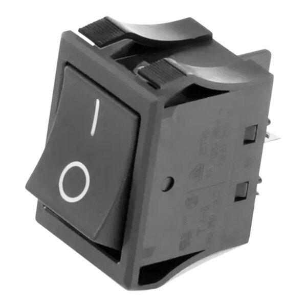 A black Merco switch with a white circle on the button.