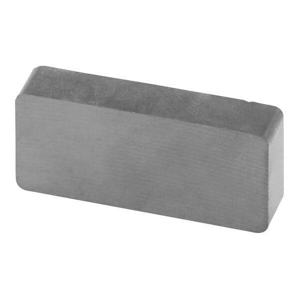 A grey rectangular magnet with a black square on it.