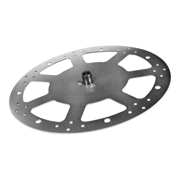 A close-up of a circular metal disc with holes.