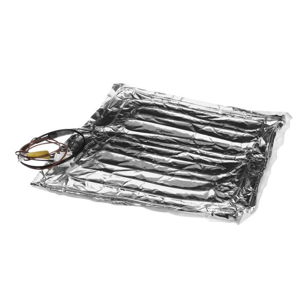 A Merco heater pad with wires and silver foil.