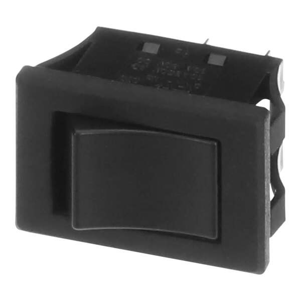 A close up of a black Merco switch with a black cover and button.