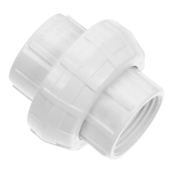 A close-up of a white plastic pipe fitting.