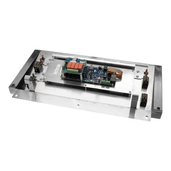 A Giles Control Retrofit Kit in a metal enclosure with a circuit board inside.
