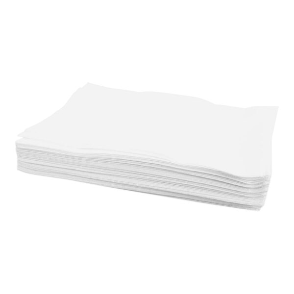 A stack of white paper filters.