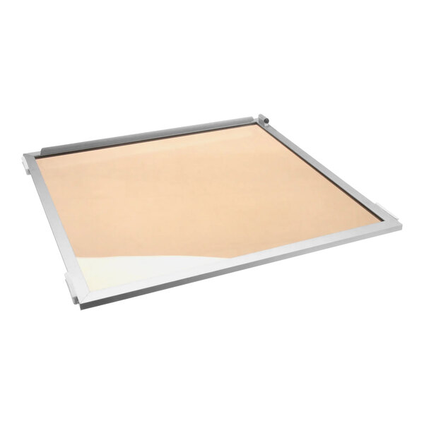 A white tray with a beige sheet on a glass door for an Alto-Shaam Tysys-72.