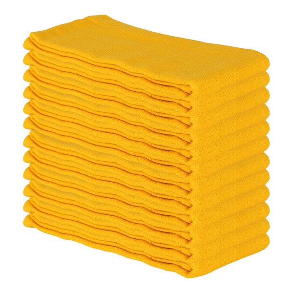 A stack of yellow Monarch Brands huck towels.