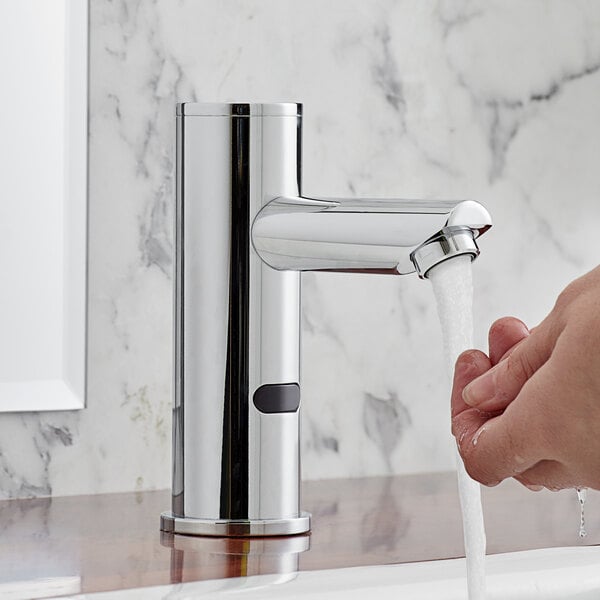 A hand washing under a Waterloo hands-free sensor faucet.