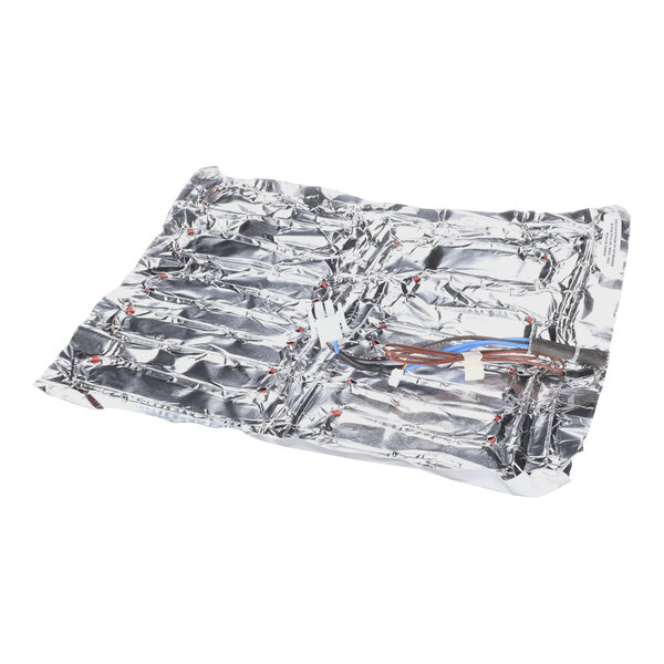 A silver foil wrapped Merco heater pad with wires.