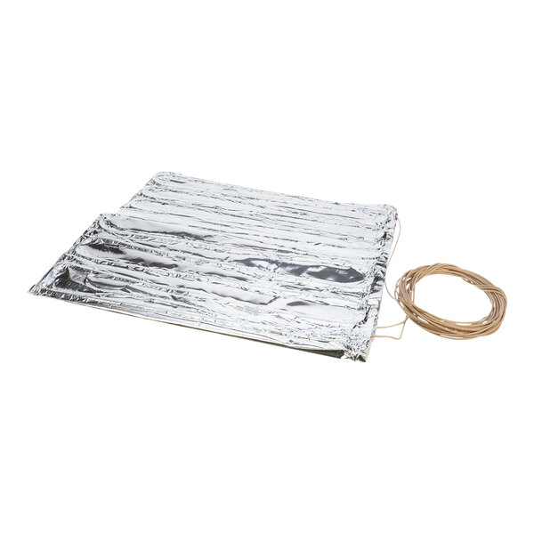 A silver foil heating pad with a wire attached.