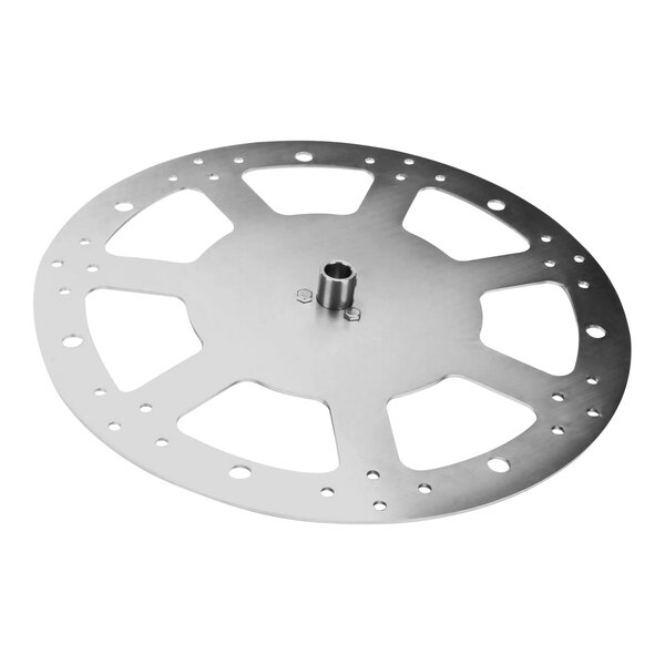 A circular metal disc with holes.