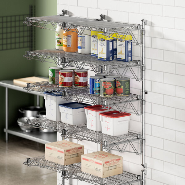 A Regency stainless steel wall-mount shelf post with double brackets holding shelves.