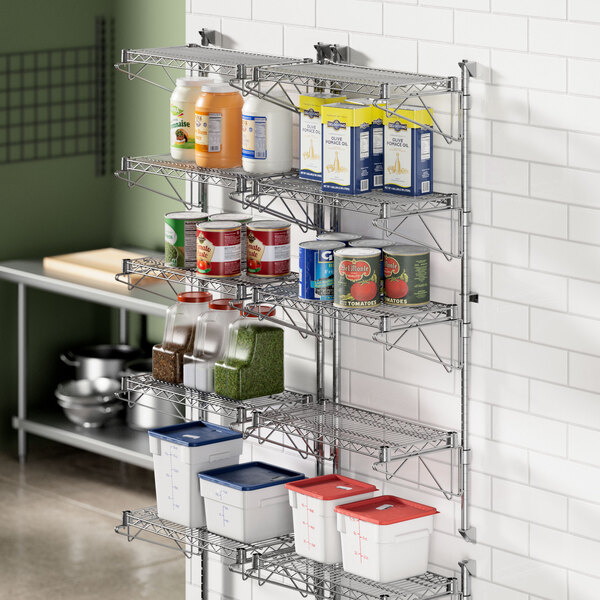 A Regency stainless steel wall-mount shelf with food items on it.