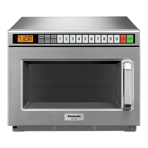 A silver Panasonic commercial microwave oven with a digital display.