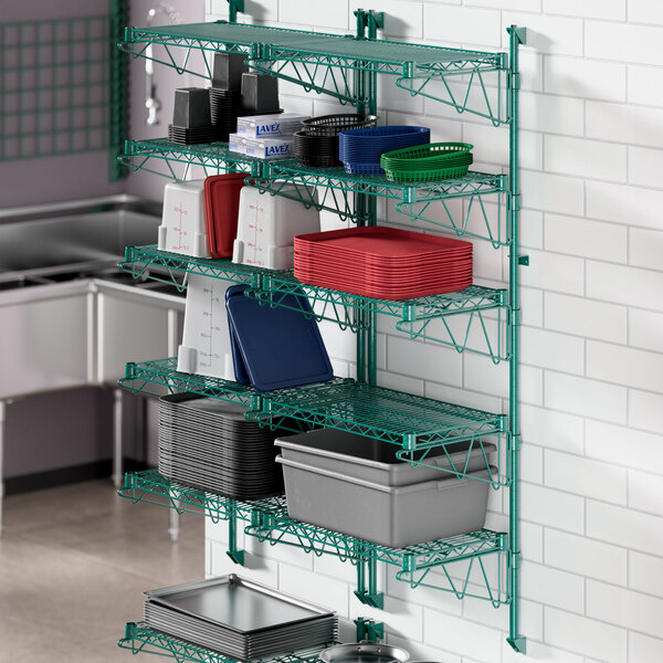 A kitchen with a green metal shelf on the wall.