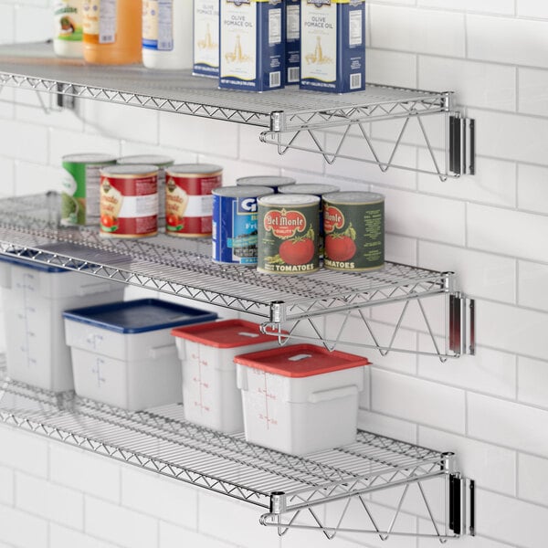 A kitchen with a Regency chrome wire shelf holding food containers and plastic bins.
