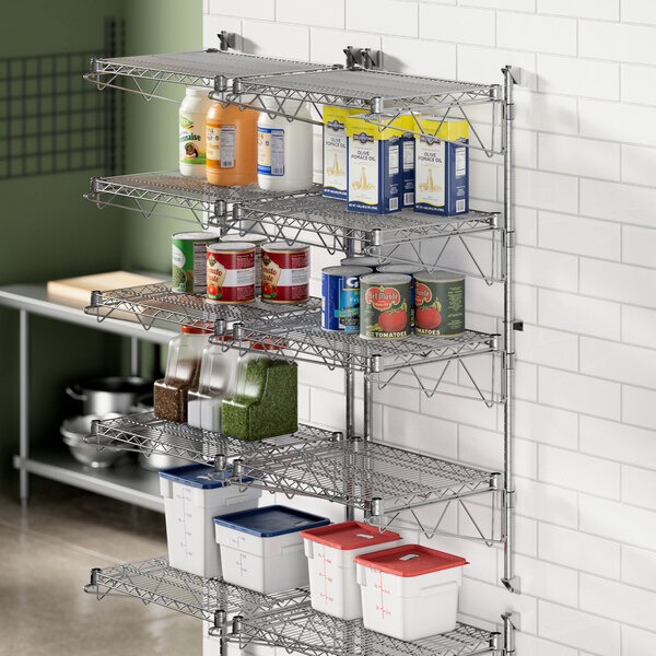 A Regency stainless steel wall-mount shelf post with food items on it.