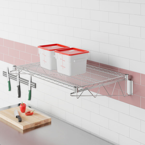 A Regency stainless steel wire shelf with white containers and a knife.