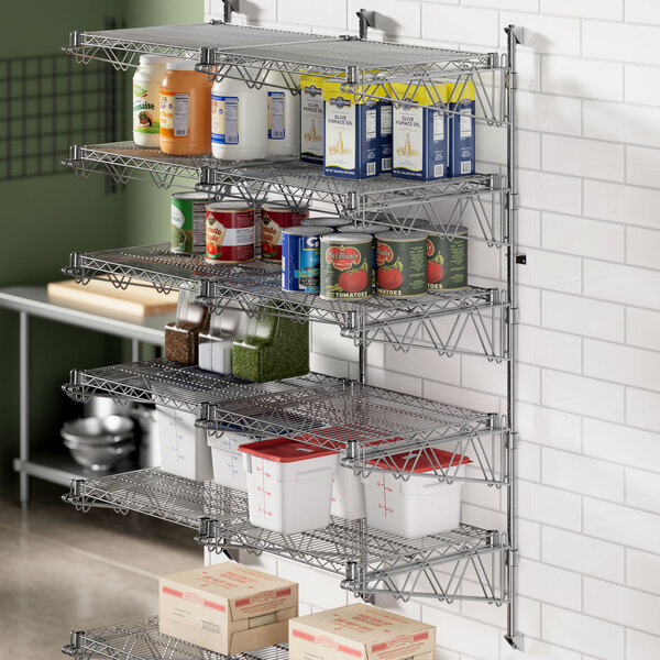 A Regency wall-mount shelf post in a professional kitchen with food on shelves.