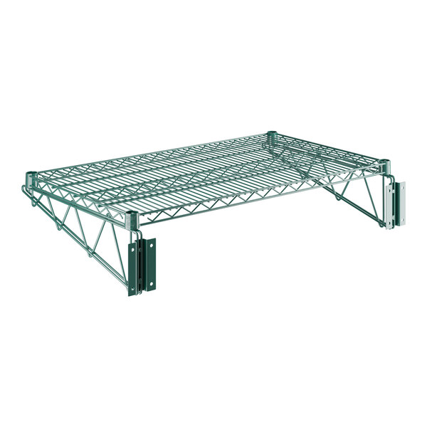 A close-up of a green metal Regency wire shelf with two metal brackets.