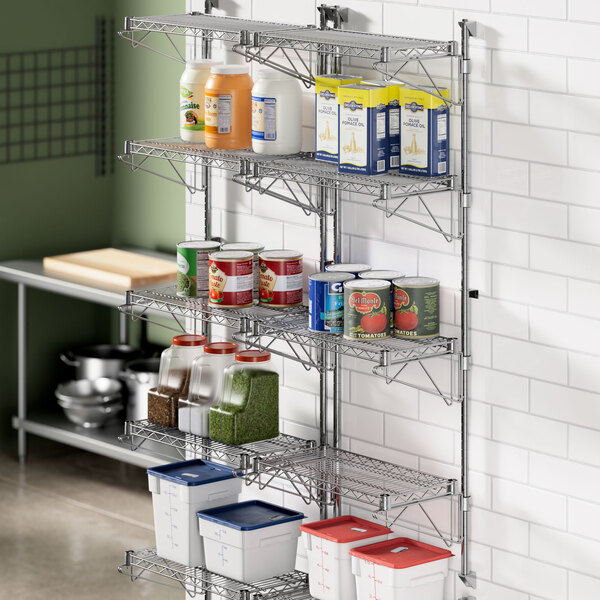 A metal Regency wall-mount wire shelf with containers on it.