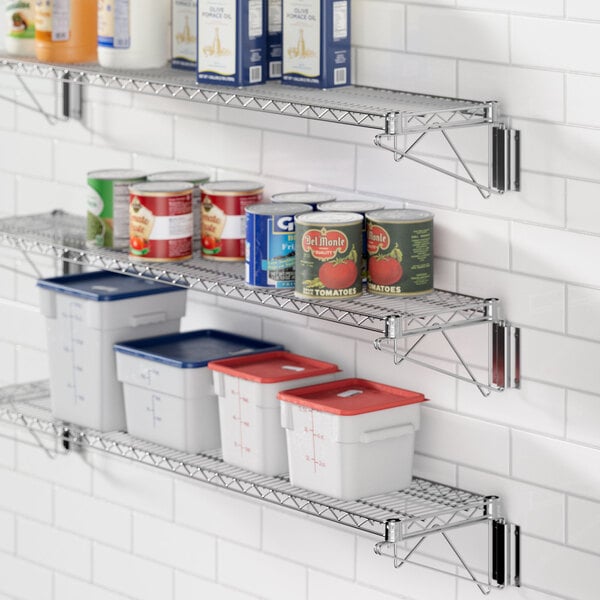 A kitchen with a Regency chrome wall-mount wire shelf holding food containers.