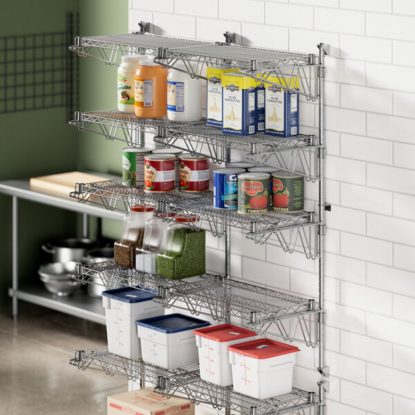 A Regency chrome wall-mount middle shelf post in a kitchen pantry with shelves and containers.