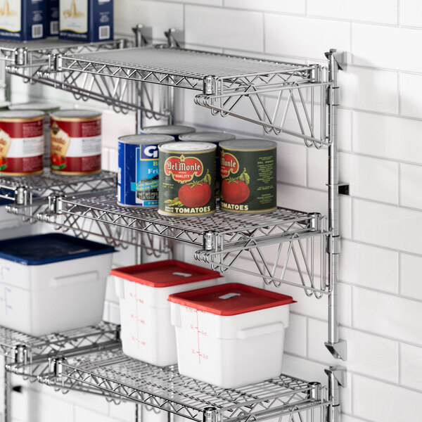 A Regency chrome wire shelf with food containers on it.