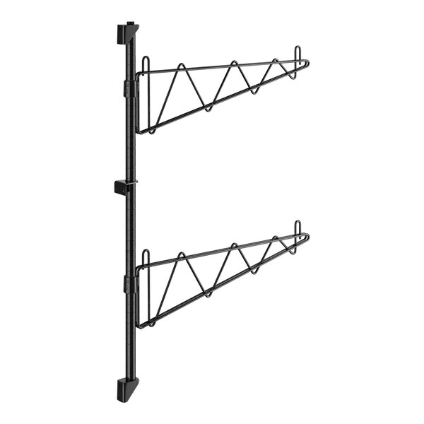 A pair of black metal Regency shelf brackets.