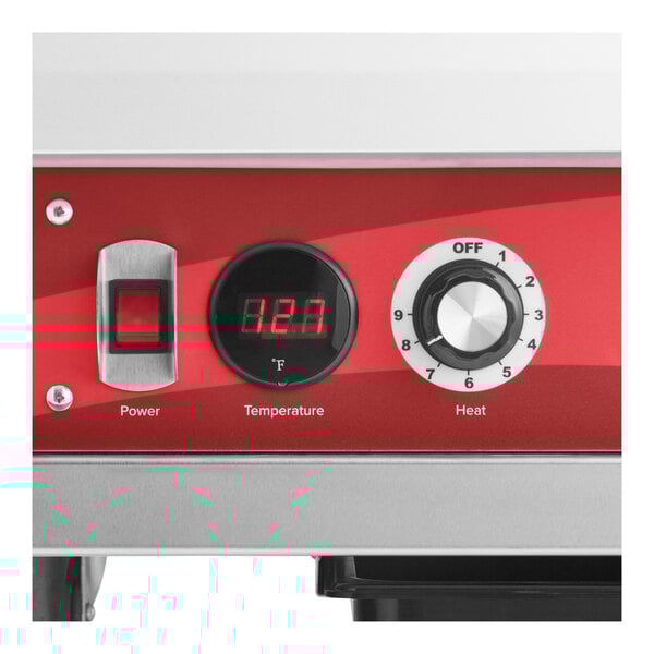 A control panel of a heated holding cabinet with a power switch, digital temperature display, and heat adjustment dial.