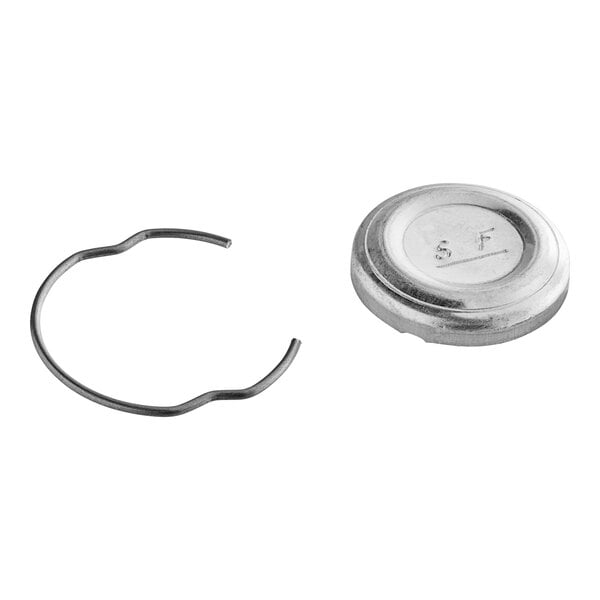 A silver metal circular cap and ring set.