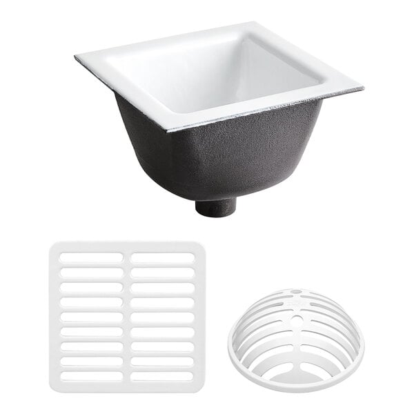 A white and black Zurn floor sink with drain and full grate.