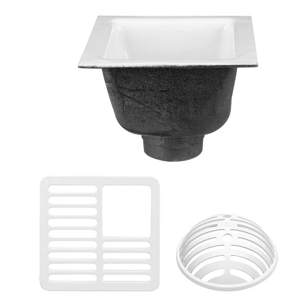 A white Zurn floor sink with a black grate over the drain.