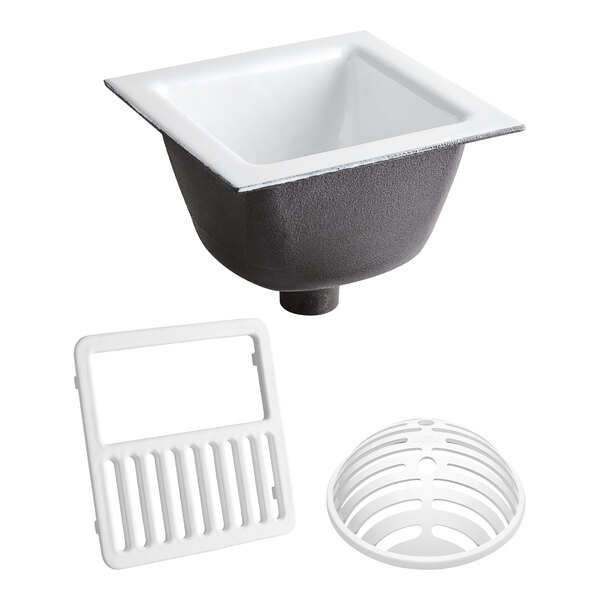 A Zurn Elkay cast iron floor sink with drain and grate.