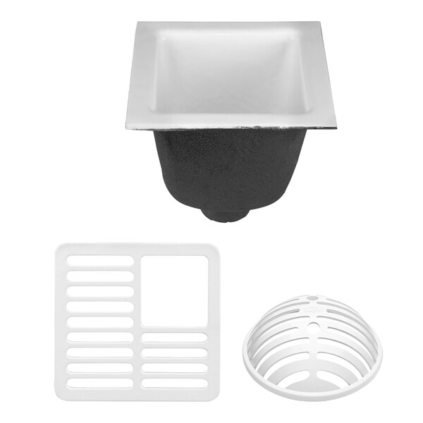 A Zurn cast iron floor sink with a white plastic drain cover with holes.